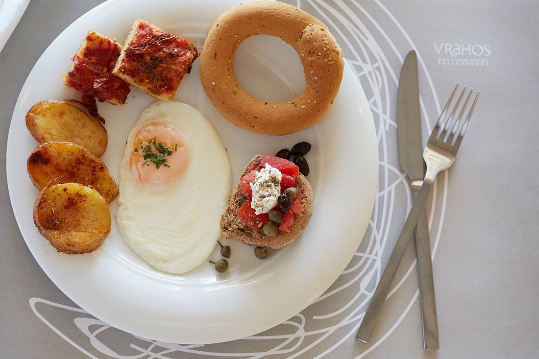 Traditional greek food in greek islands, cyclades. Folegandros hotels booking online with free greek breakfast